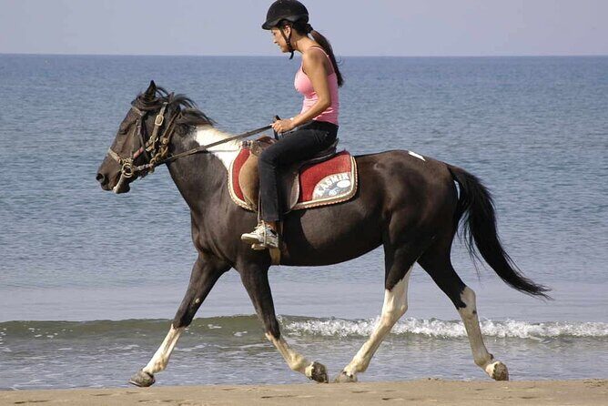 Horse Riding on the Beach in Side - Safety Gear and a Real Guide Lead the Way
